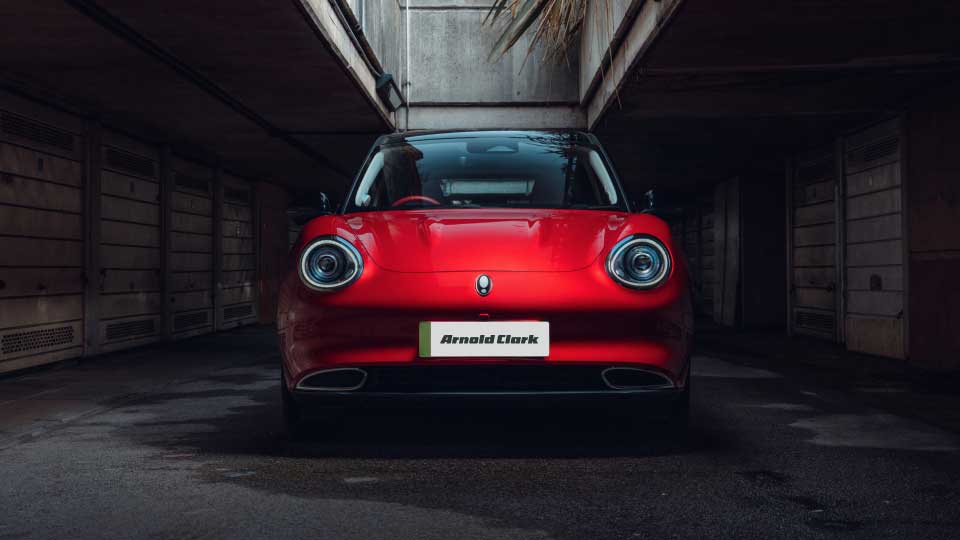 Front-on image of a Red GWM ORA 03 in a subway tunnel